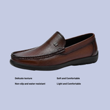 A pair of the chestnut brown Men's Full-Grain Leather Dress Slip-On Loafers