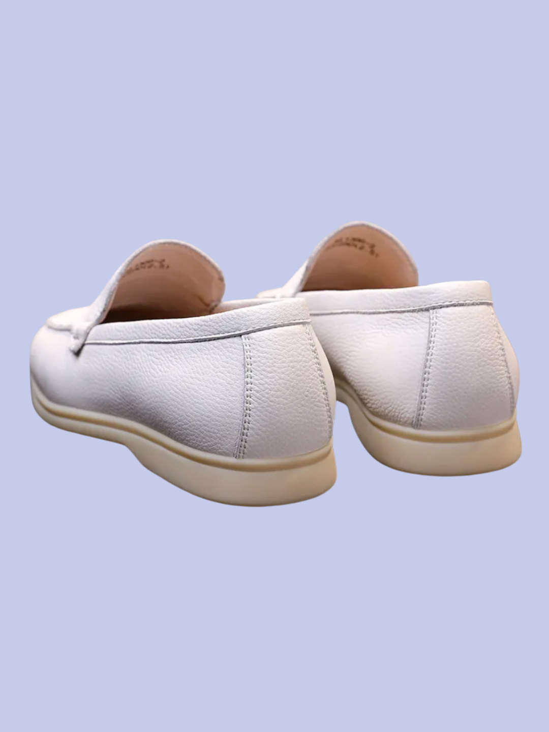 Both views of the black of the white Pebbled Leather Slip-On Loafers