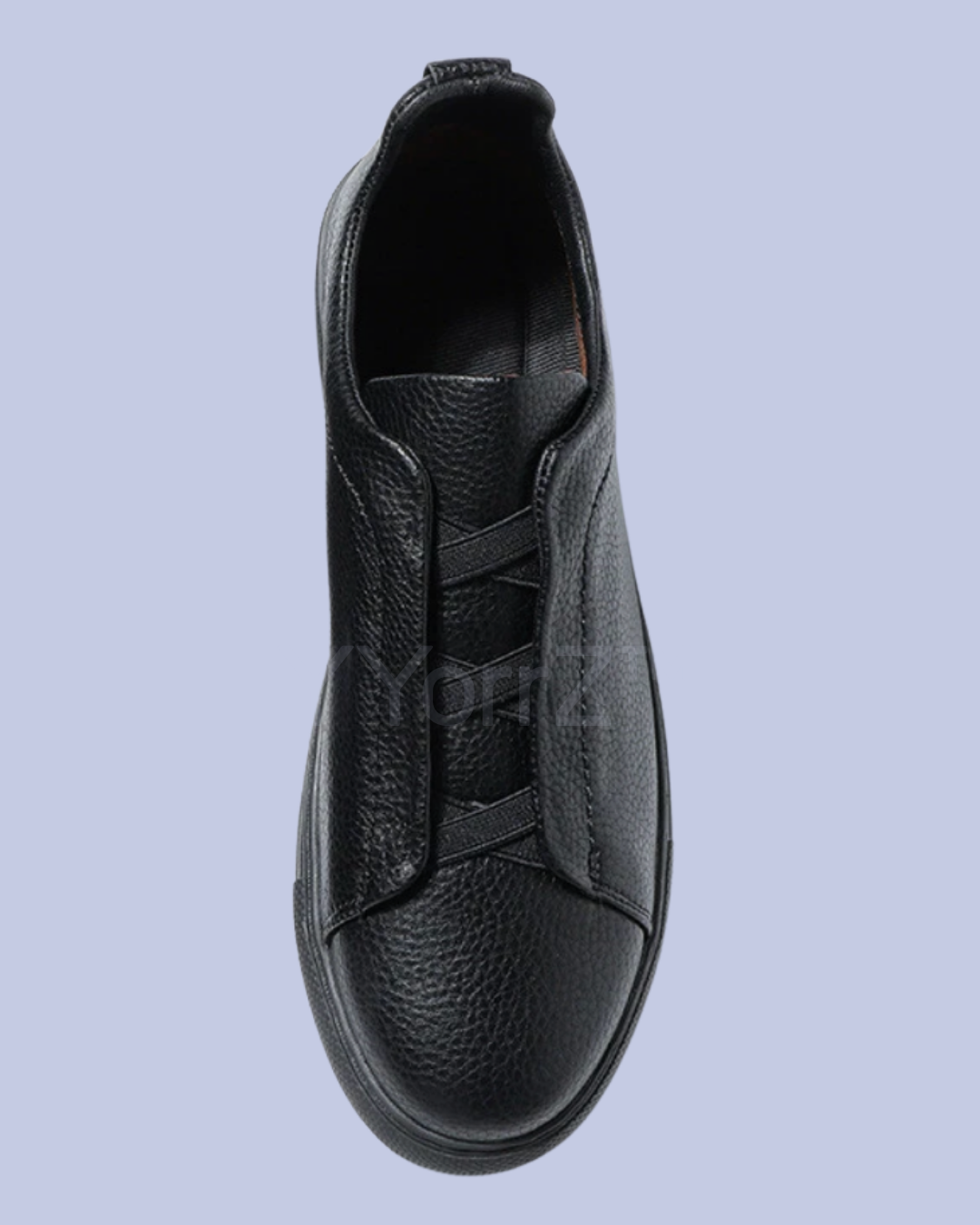 The left pair of the Black Triple Stitch Slip-On Low-Top Sneakers