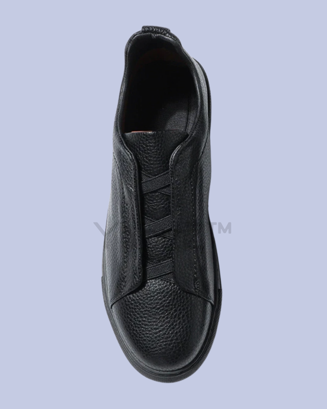 The right pair of the Black Triple Stitch Slip-On Low-Top Sneakers