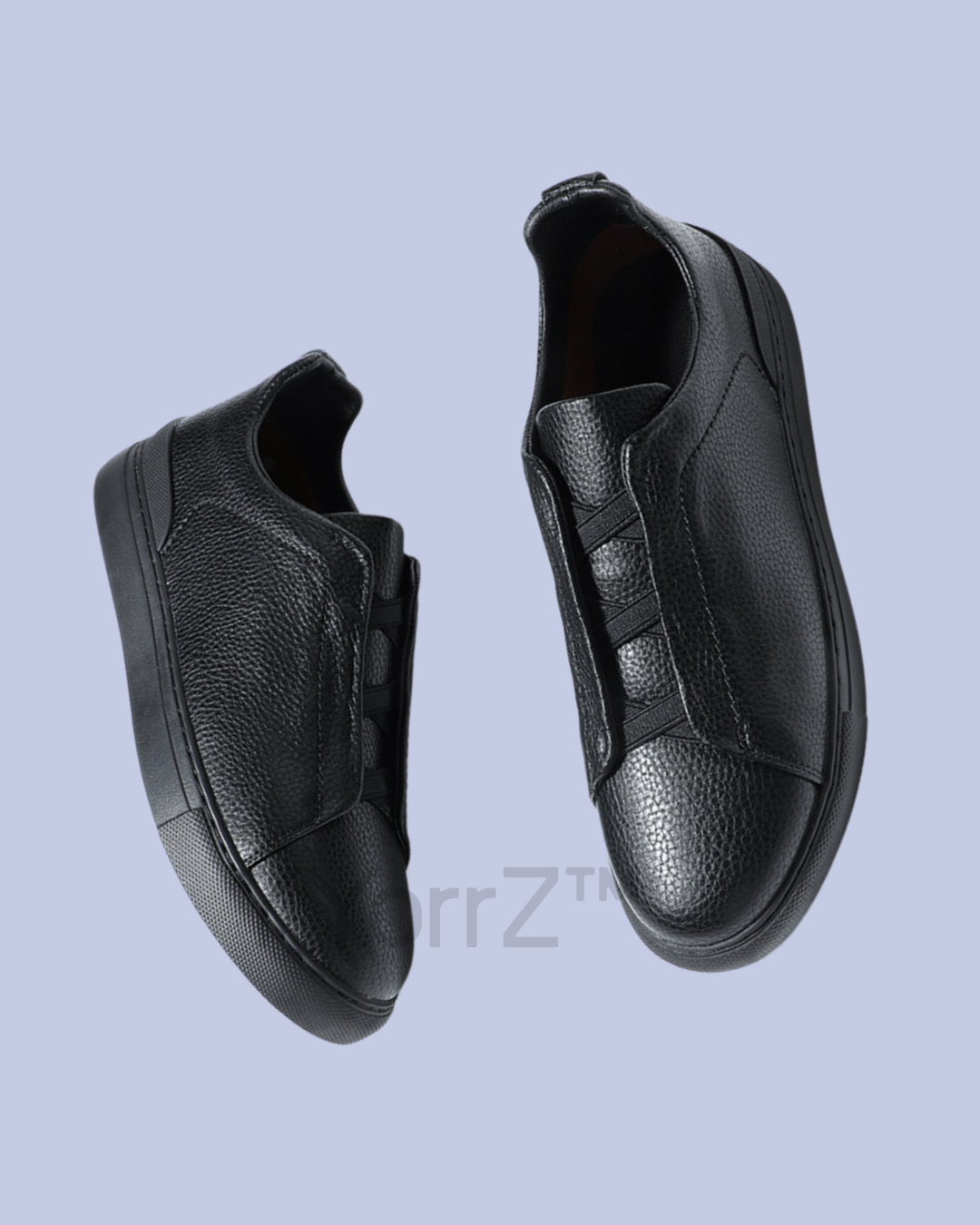 A slide view of the Black Triple Stitch Slip-On Low-Top Sneakers
