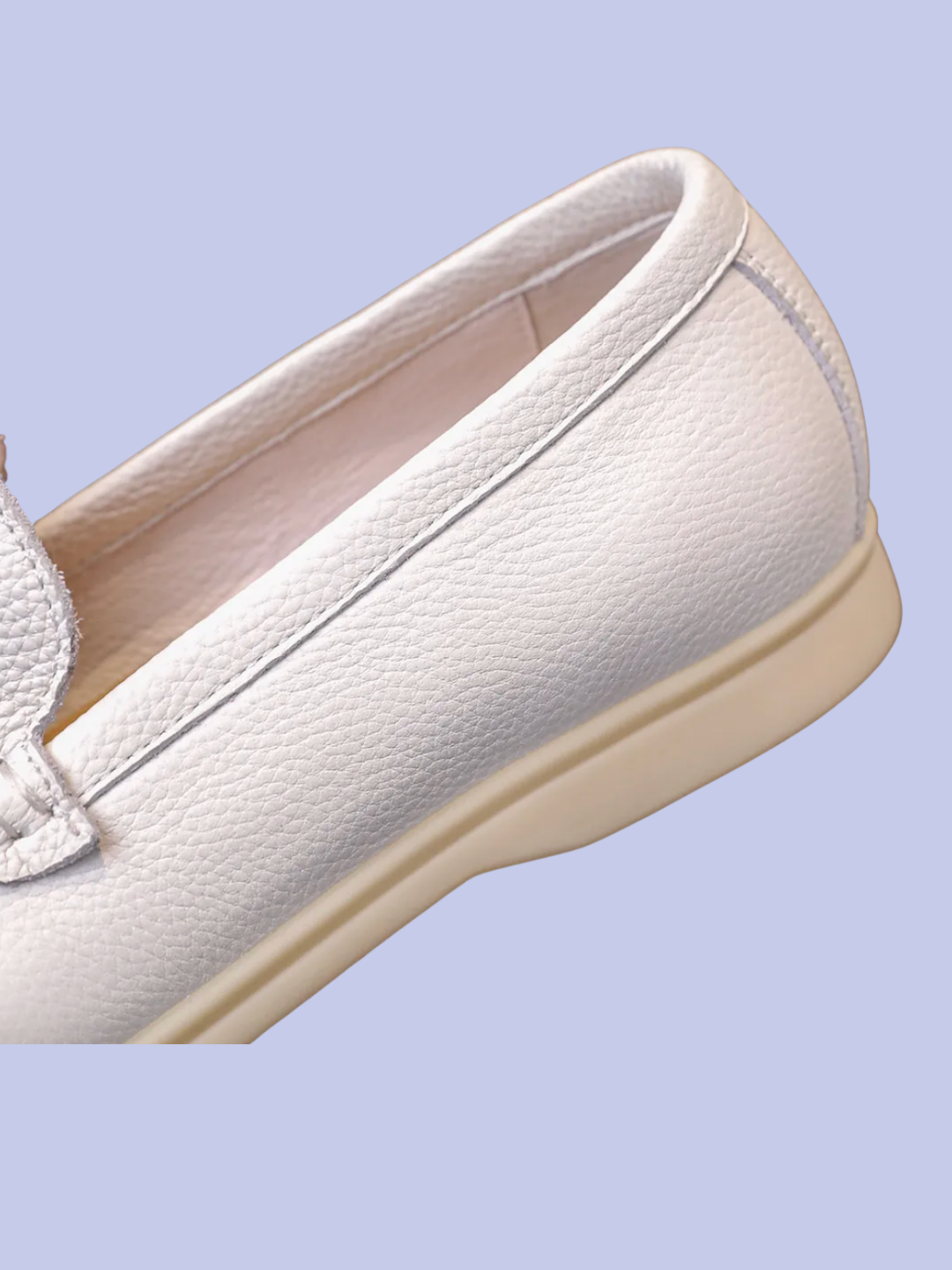 The back view of the white Pebbled Leather Slip-On Loafers