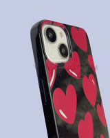 The side view of the Glossy Bold Red Hearts iPhone Case