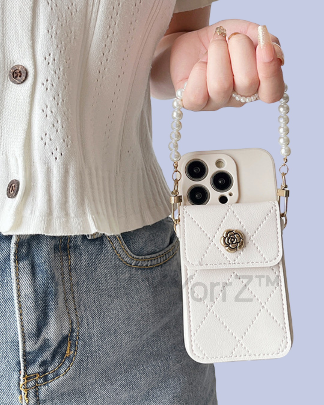 The white Crossbody Quilted iPhone Wallet Case with Pearl Chain Strap in real life