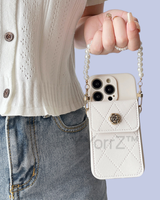 The white Crossbody Quilted iPhone Wallet Case with Pearl Chain Strap in real life